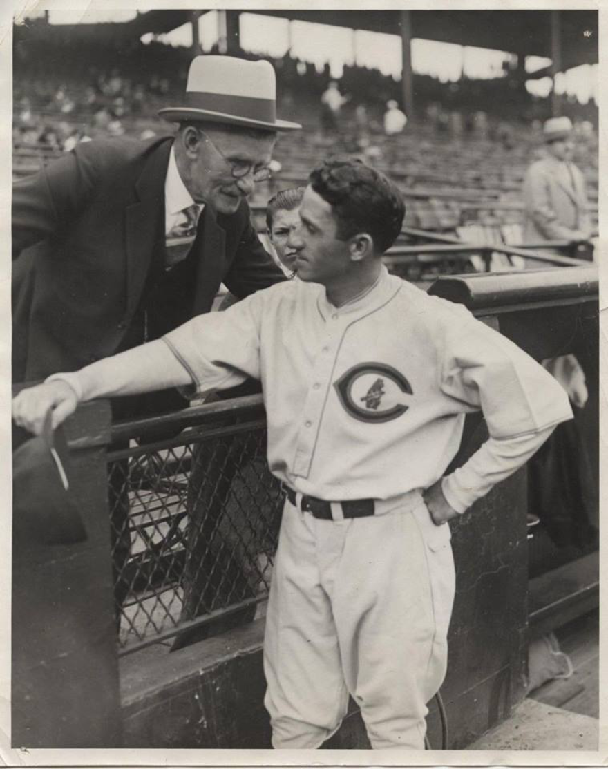 "Kiki" Cuyler confers with his father in the stands during a game. Cuyler's granddaughter, KiAnn Kruttlin, says family was very important to Cuyler.